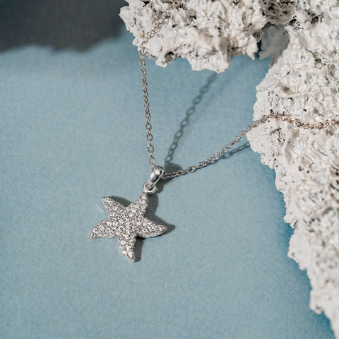 Star pendant on 18K gold chain