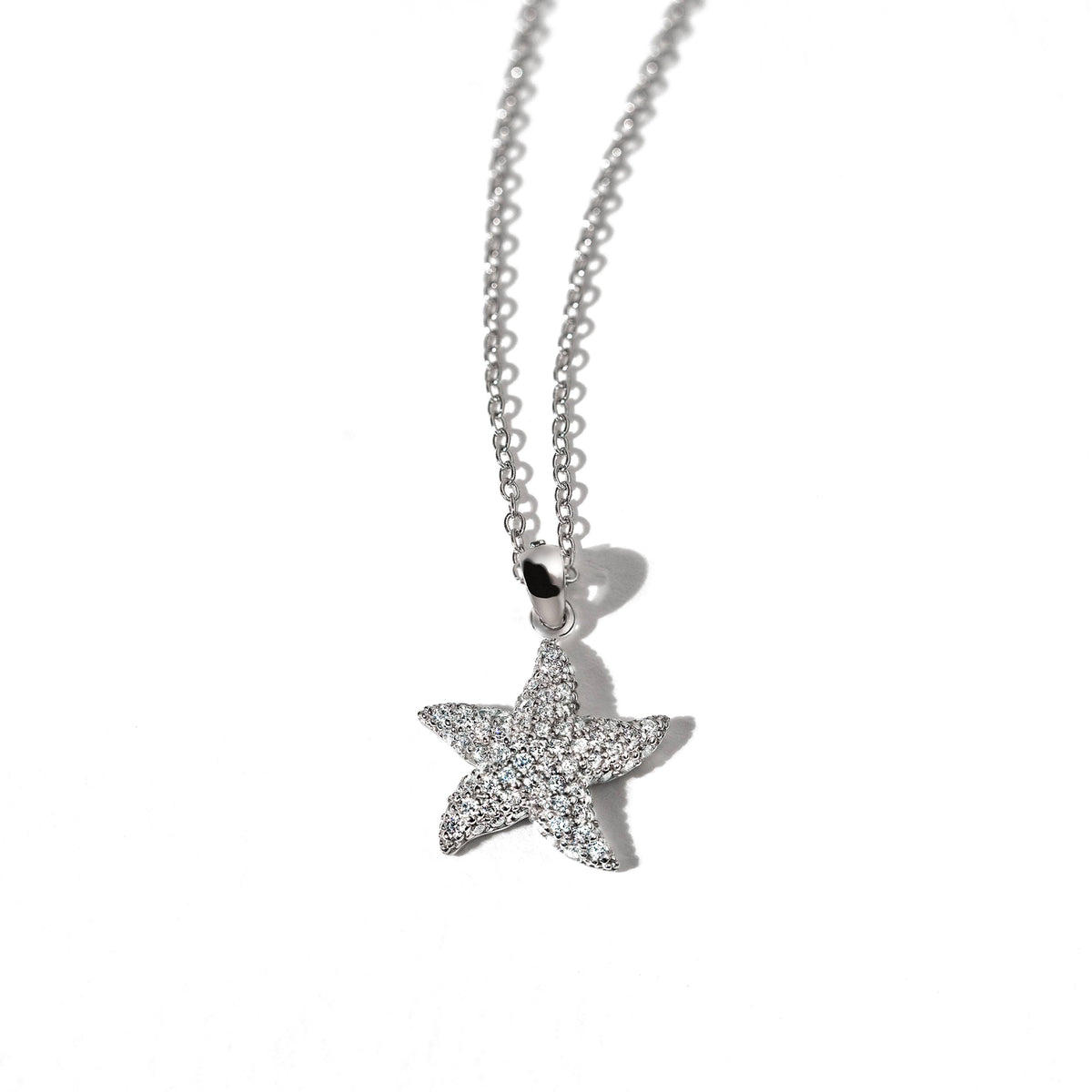 Star pendant on 18K gold chain